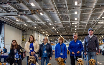 USS Ronald Reagan (CVN 76) welcomes therapy dogs from Love on a Leash