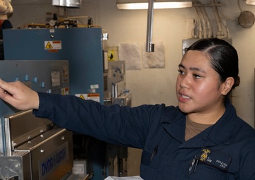 Sailors Conduct Maintenance in Ship's Laundry