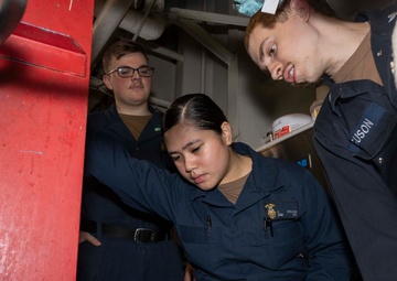 Sailors Conduct Maintenance in Ship's Laundry
