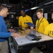 Sailors Discuss the Flight Plan