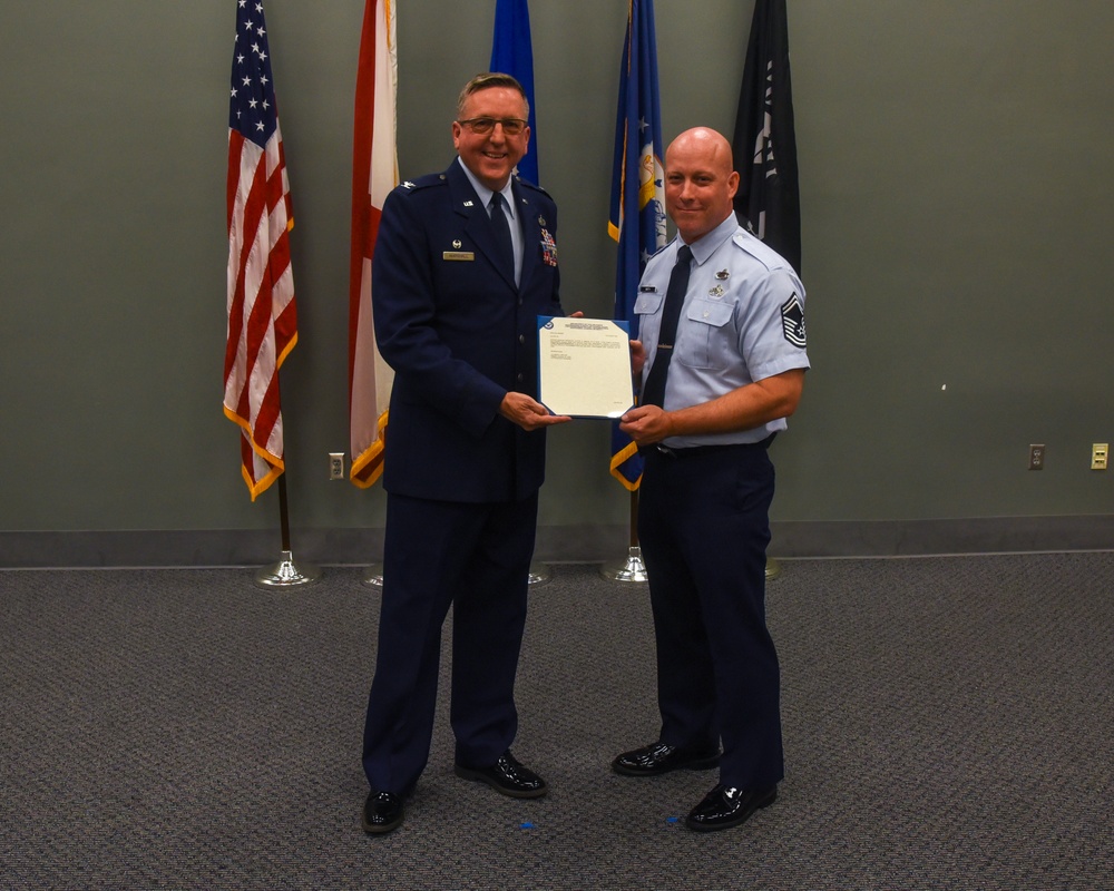 SMSGT Smith is promoted in a ceremony