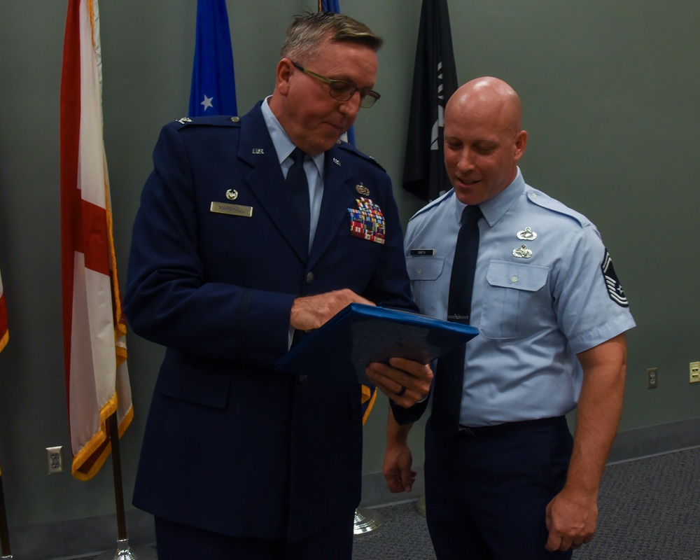 SMSGT Smith is promoted in a ceremony