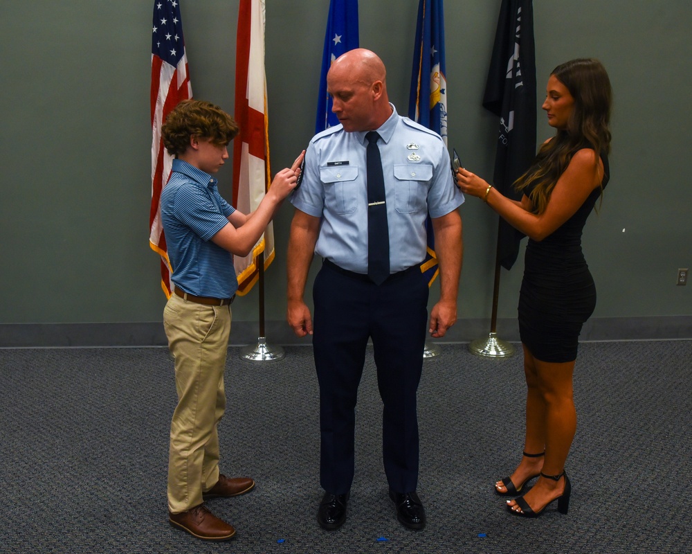 SMSGT Smith is promoted in a ceremony