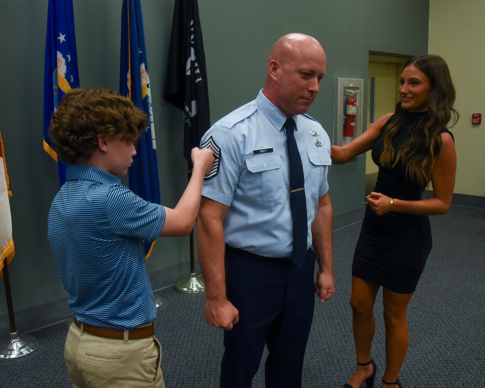 SMSGT Smith is promoted in a ceremony