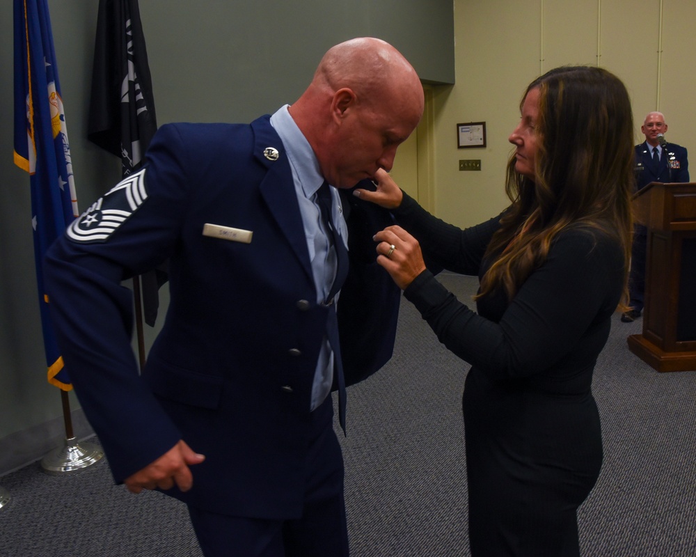 SMSGT Smith is promoted in a ceremony