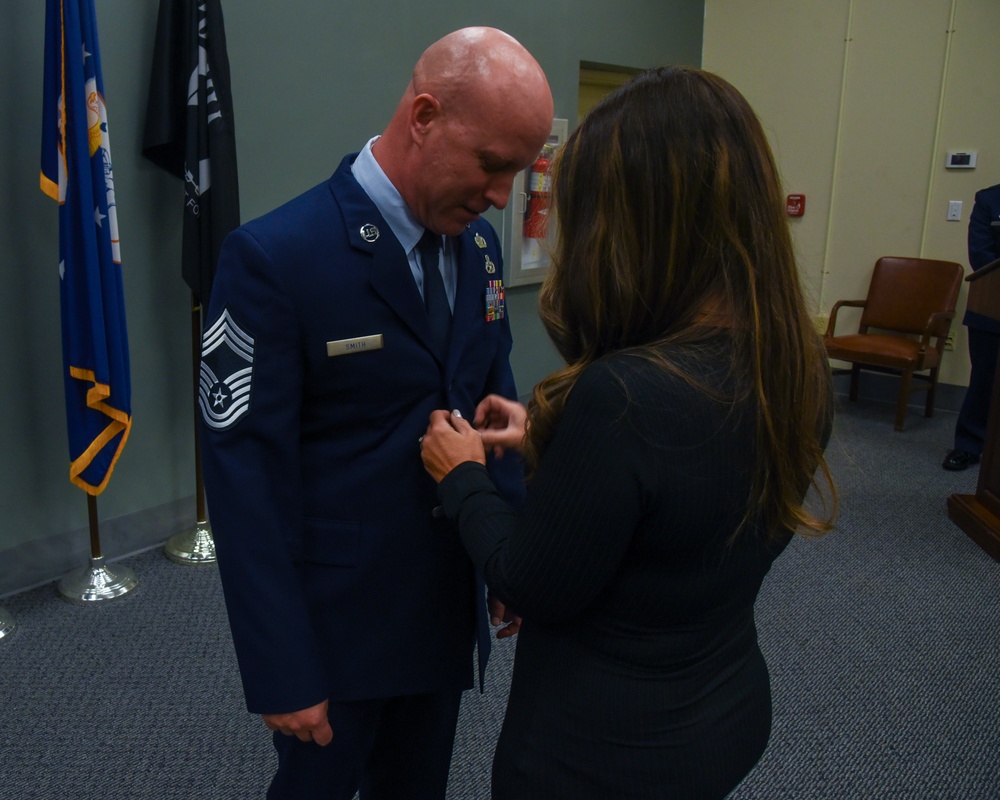 SMSGT Smith is promoted in a ceremony