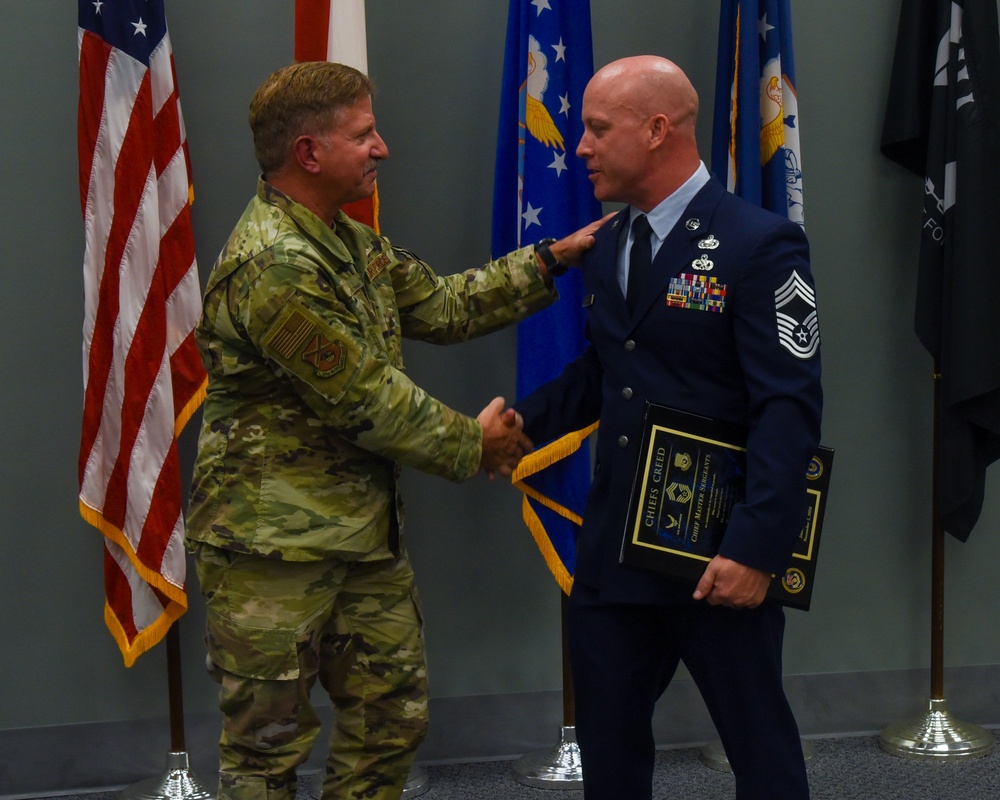 SMSGT Smith is promoted in a ceremony