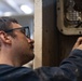 Weapons department Sailor replaces wiring insulation aboard USS George Washington