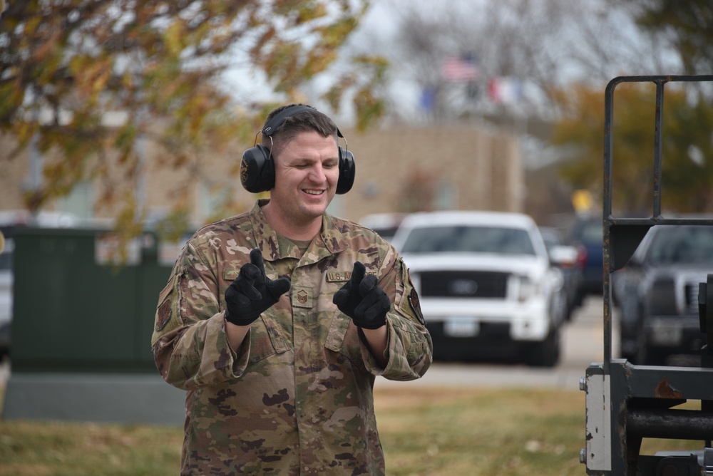 Master Sgt. Derrick Danker guides 10K Forklift