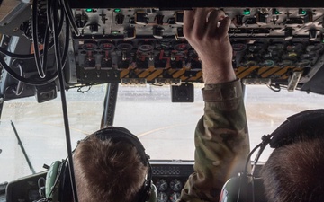 Crew Chiefs with 182nd Aircraft Maintenance Squadron inspect C-130H3 Hercules' APU