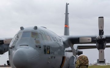 Crew Chiefs with 182nd Aircraft Maintenance Squadron inspect C-130H3 Hercules' APU