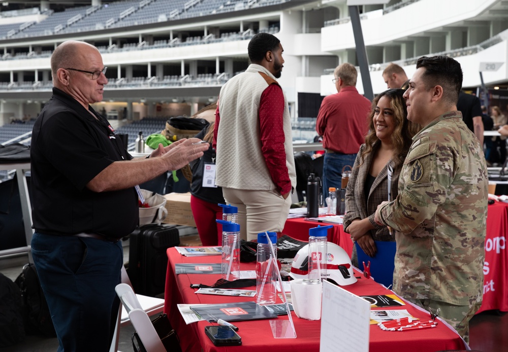 Spouse gets information about a new career at the Total Army Career Fair