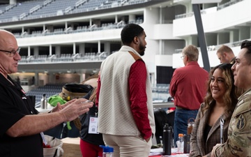 Spouse gets information about a new career at the Total Army Career Fair