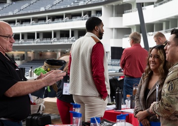 Spouse gets information about a new career at the Total Army Career Fair