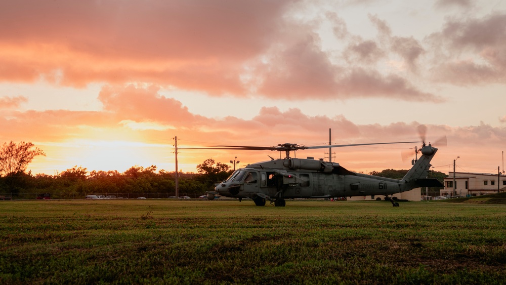 HSC-12 flies during sunset in Guam