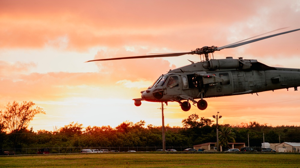 HSC-12 flies during sunset in Guam