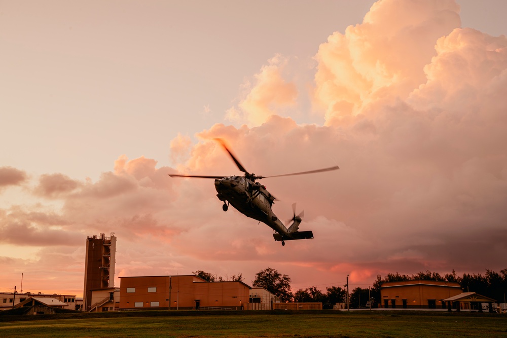 HSC-12 flies during sunset in Guam