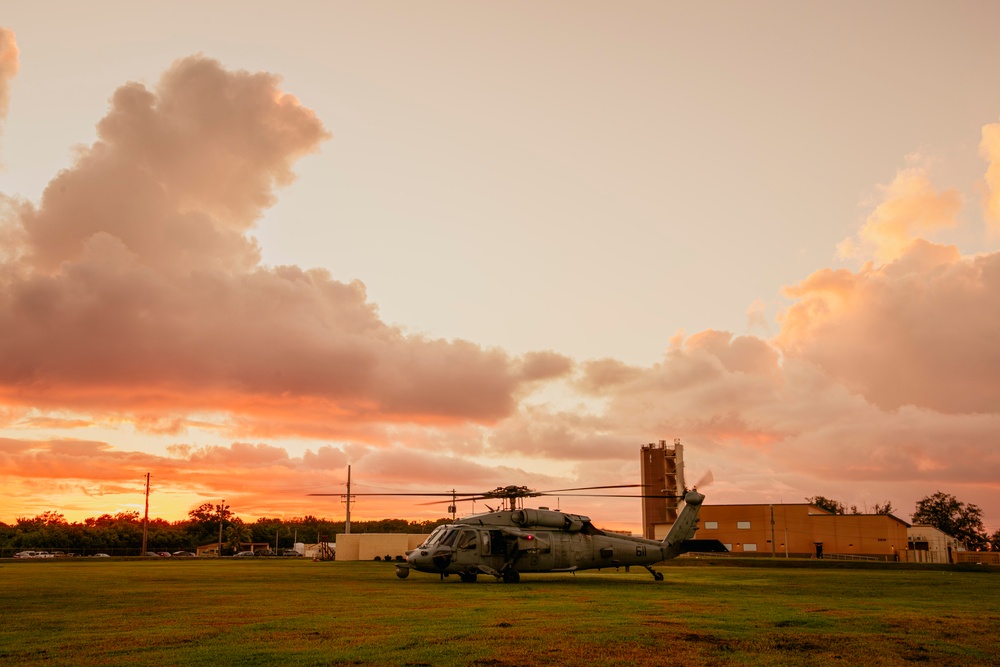 HSC-12 flies during sunset in Guam