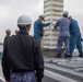 Keen Sword 25: JMSDF Murasame-class destroyer JS Inazuma (DD 105) picks up simulated ammunition at MCAS Iwakuni harbor