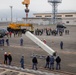 Keen Sword 25: JMSDF Murasame-class destroyer JS Inazuma (DD 105) picks up simulated ammunition at MCAS Iwakuni harbor