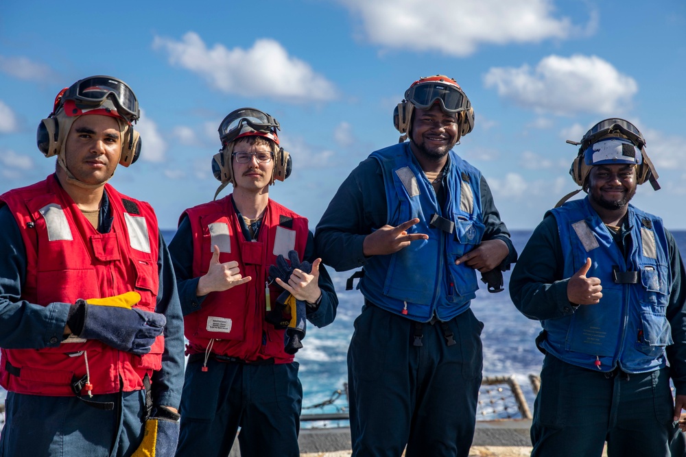 USS Ralph Johnson Conducts A Helicopter in-flight Refueling Exercise.