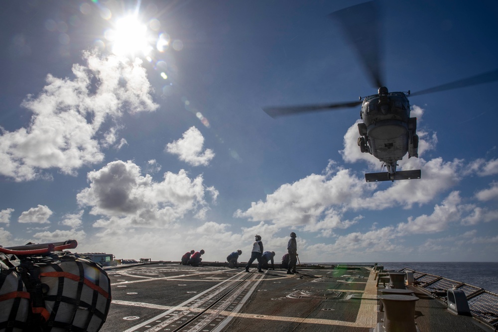 USS Ralph Johnson Conducts A Helicopter in-flight Refueling Exercise.