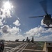 USS Ralph Johnson Conducts A Helicopter in-flight Refueling Exercise.