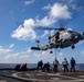 USS Ralph Johnson Conducts A Helicopter in-flight Refueling Exercise.
