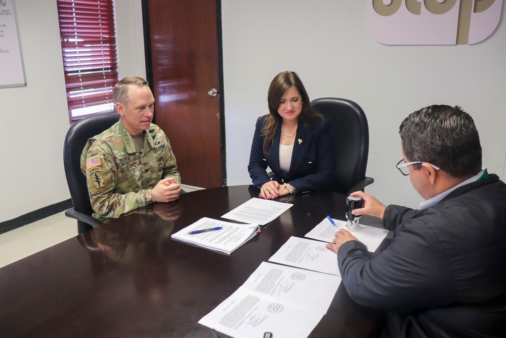 A Puerto Rico Department of Transportation and Public Works lawyer stamps the Project Partnership Agreement for the Río Grande de Manatí Flood Risk Management Project in Ciales