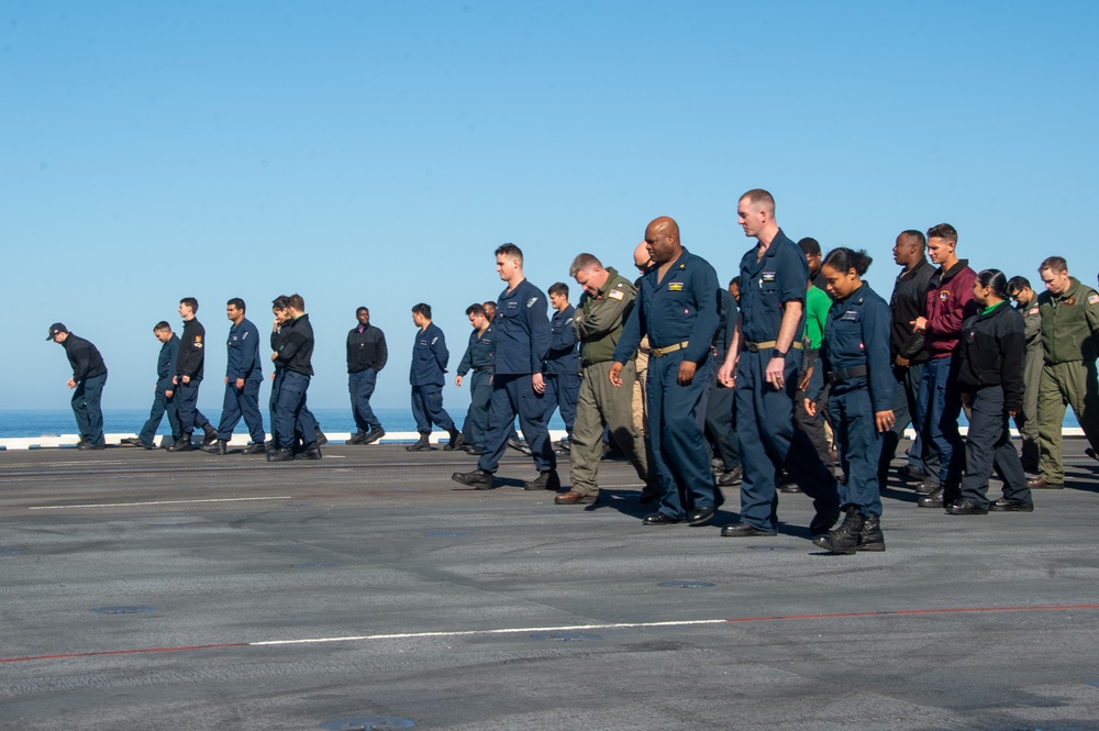 USS Ronald Reagan (CVN 76) Sailors conduct a FOD walk down