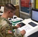 Soldier works in USAMMC-K optical lab