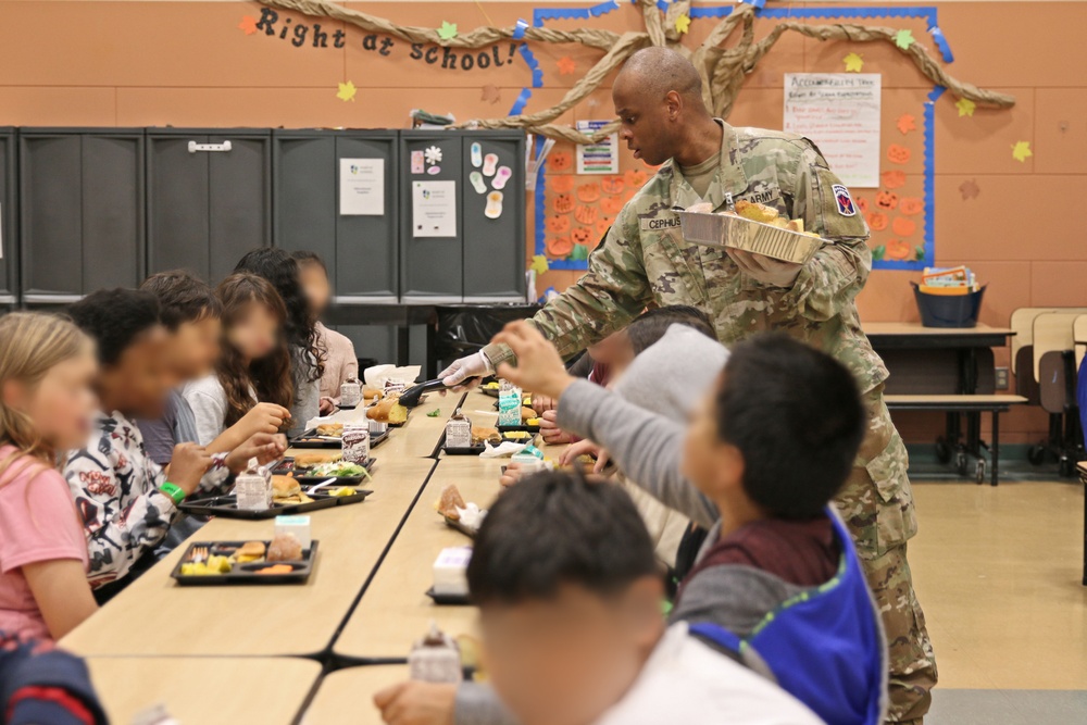 593d ESC Unit Ministry Team Joins Thompson Elementary Students for Dia De Los Muertos Lunch