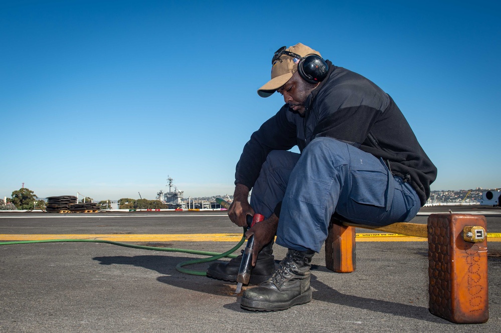 USS Carl Vinson (CVN 70) Sailor Performs Maintenance