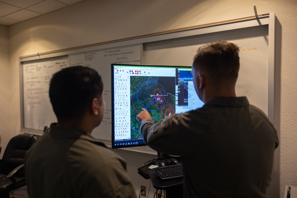 U.S. Marines with VMUT-2 conduct flight simulations and aircraft familiarization