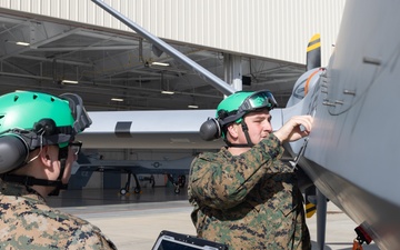 U.S. Marines with VMUT-2 conduct flight simulations and aircraft familiarization