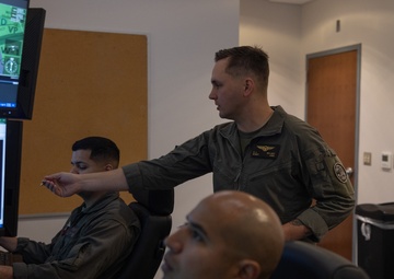 U.S. Marines with VMUT-2 conduct flight simulations and aircraft familiarization