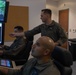 U.S. Marines with VMUT-2 conduct flight simulations and aircraft familiarization