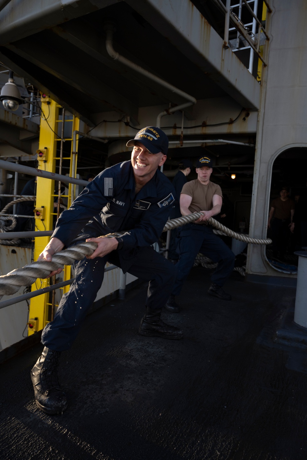 Nimitz Sailors Heave Around Line On The Fantail