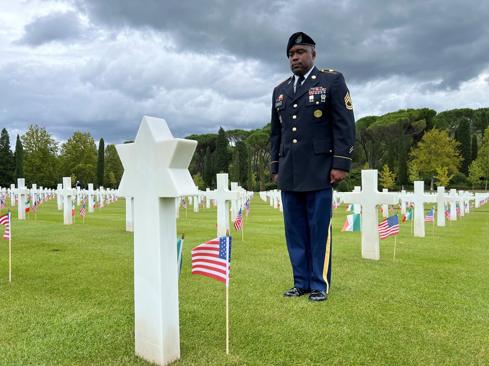 Camp Darby soldier stands at WWII graveside