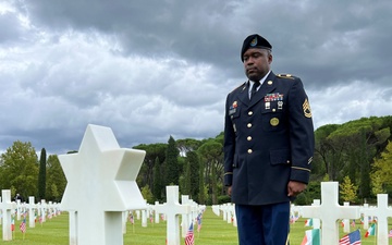 Camp Darby soldier stands at WWII graveside