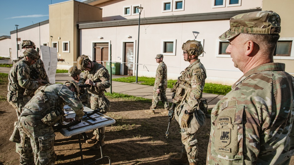 Command Sgt. Maj. Reese Teakell walks through E3B lanes
