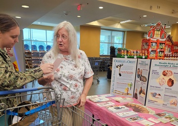 Commissary shoppers educated by Naval Hospital Jacksonville Wellness Employee