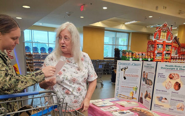Commissary shoppers educated by Naval Hospital Jacksonville Wellness Employee
