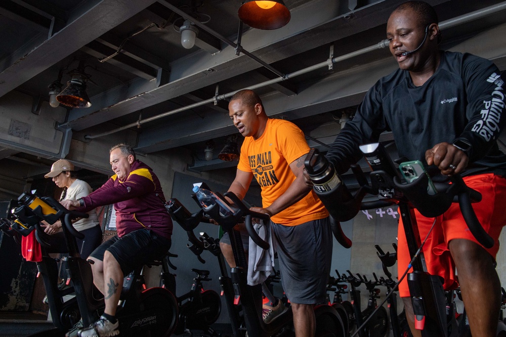 USS Ronald Reagan (CVN 76) Sailors participate in a Cycle-to-End-the-Cycle challenge