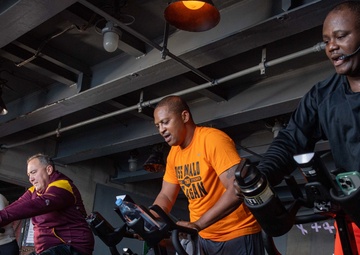 USS Ronald Reagan (CVN 76) Sailors participate in a Cycle-to-End-the-Cycle challenge