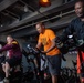 USS Ronald Reagan (CVN 76) Sailors participate in a Cycle-to-End-the-Cycle challenge