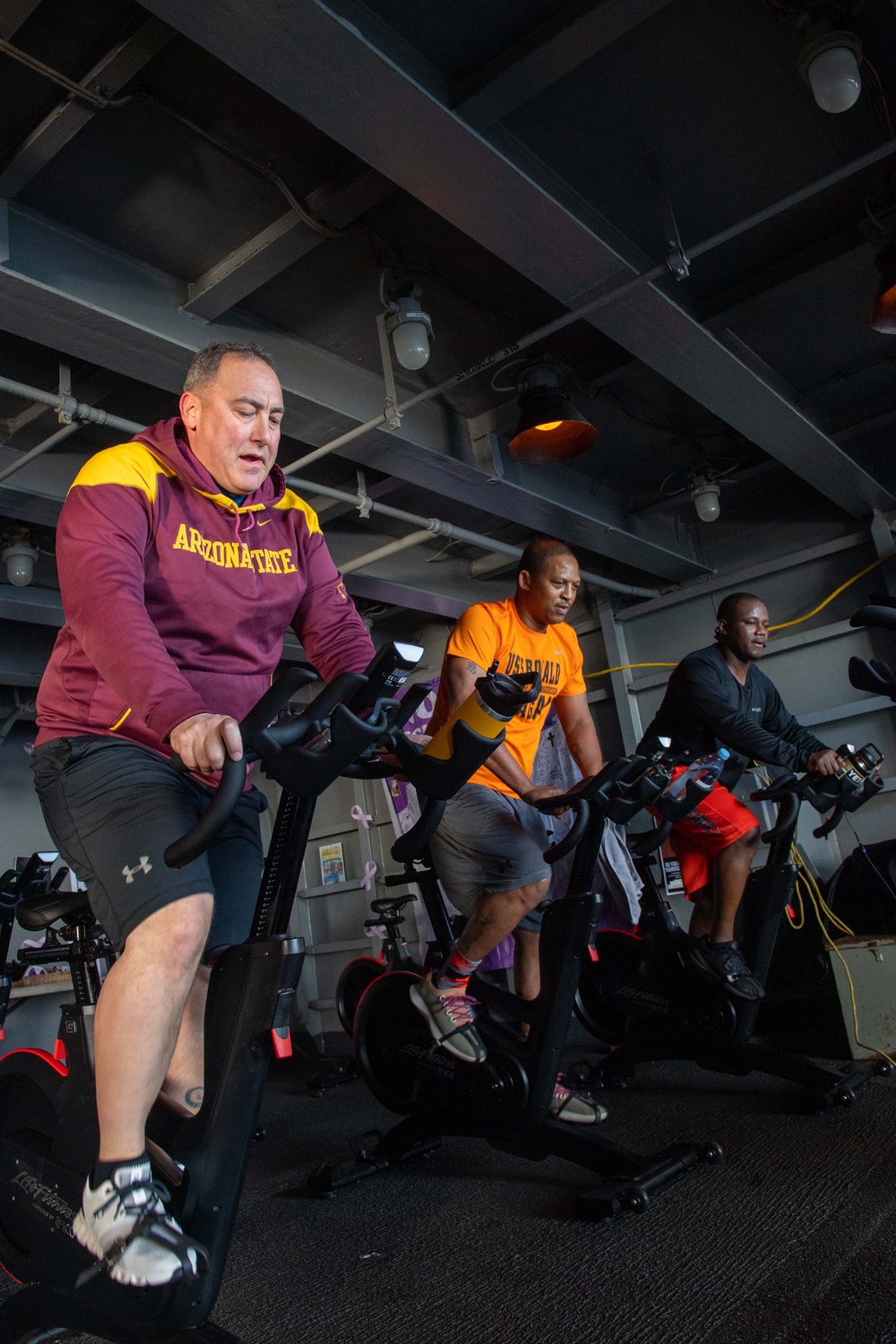 USS Ronald Reagan (CVN 76) Sailors participate in a Cycle-to-End-the-Cycle challenge