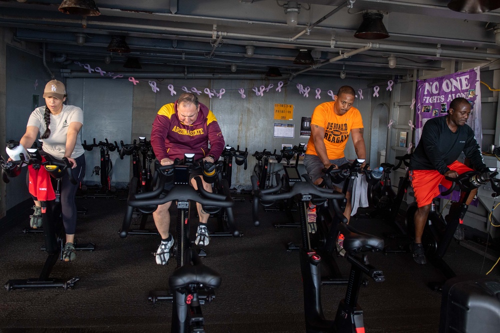 USS Ronald Reagan (CVN 76) Sailors participate in a Cycle-to-End-the-Cycle challenge