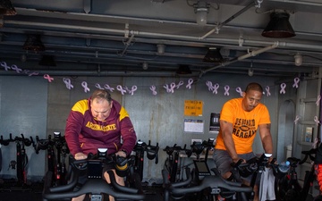 USS Ronald Reagan (CVN 76) Sailors participate in a Cycle-to-End-the-Cycle challenge