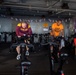 USS Ronald Reagan (CVN 76) Sailors participate in a Cycle-to-End-the-Cycle challenge